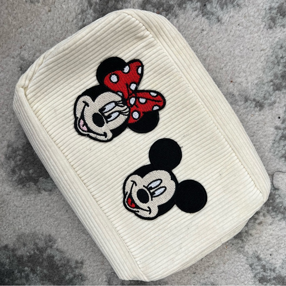 Cream small pouch with Mickey & Minnie patches sewn on